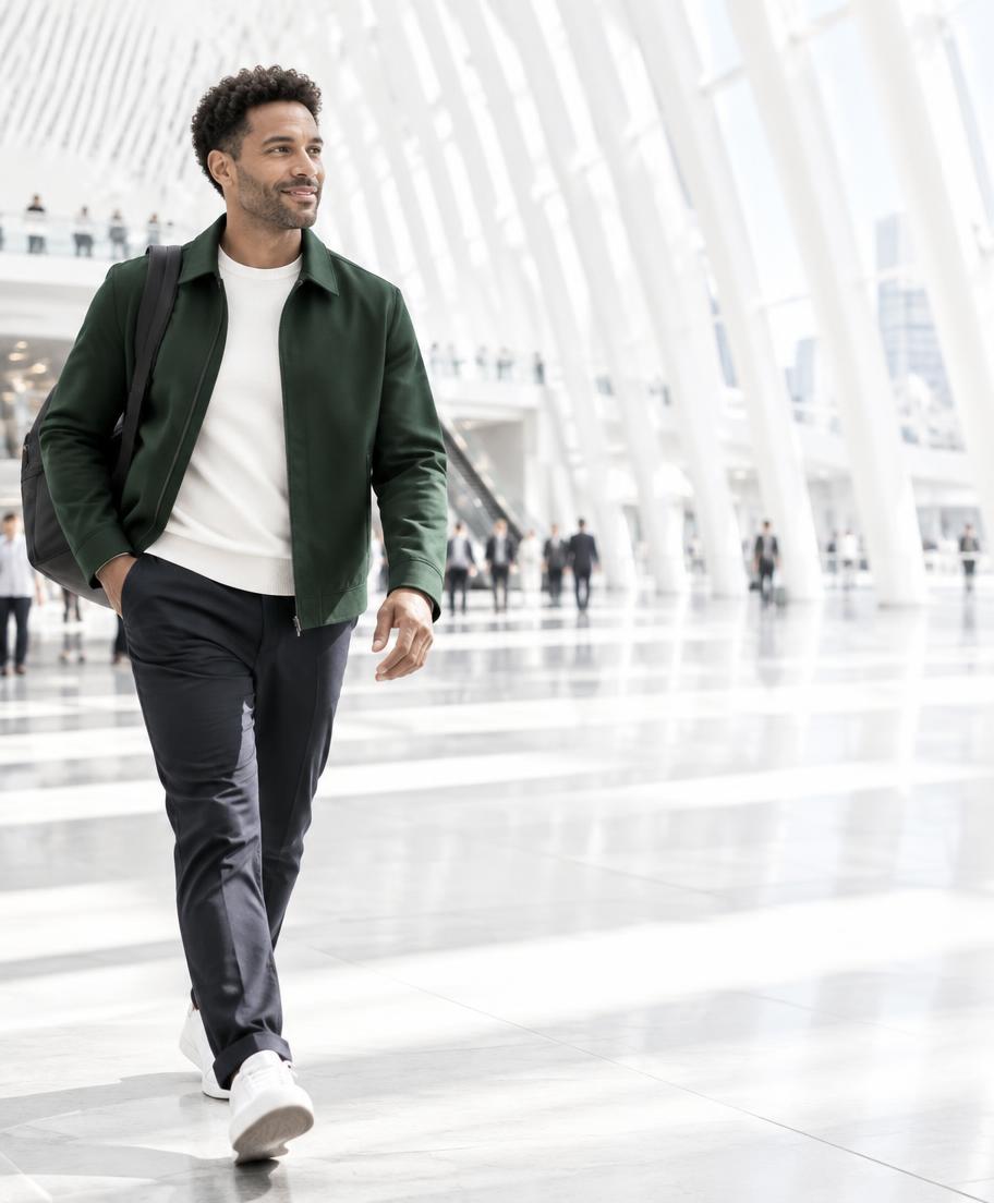 A man walking through a bright station